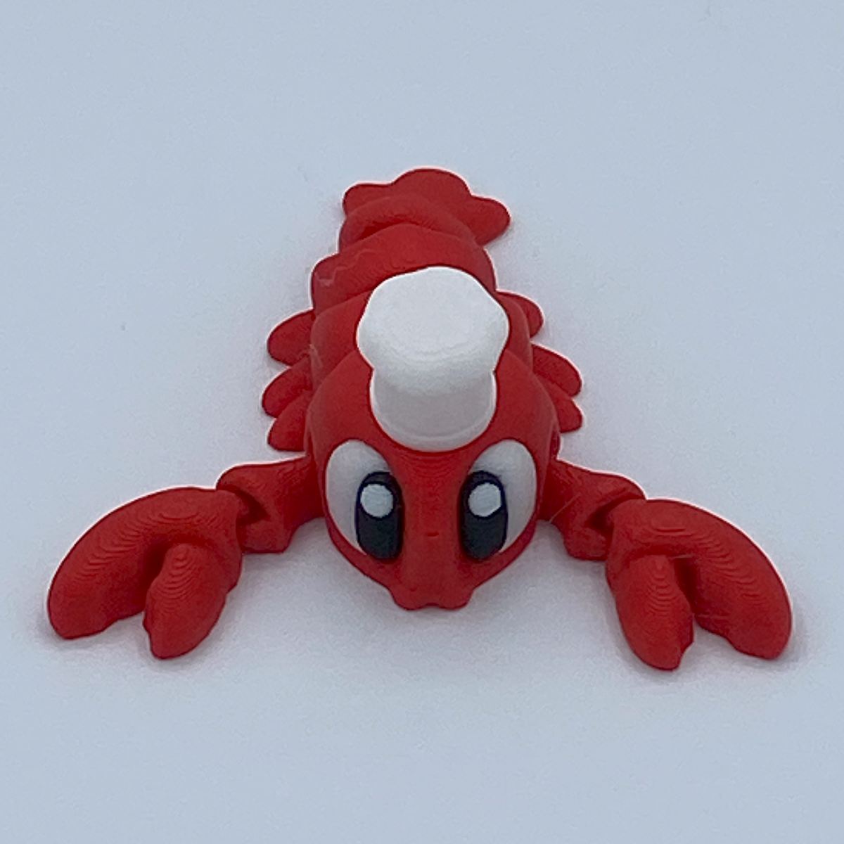 Red lobster figurine on a white background
