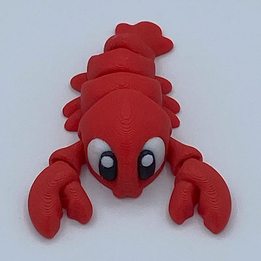 Red lobster toy on a white background
