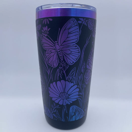 Wildflowers and Butterflies engraved tumbler in blue and purple rainbow finish with laser engraved floral design