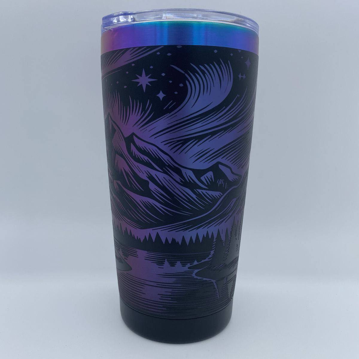 Aurora Mountain engraved tumbler in blue and purple rainbow finish with laser engraved northern lights and mountain design