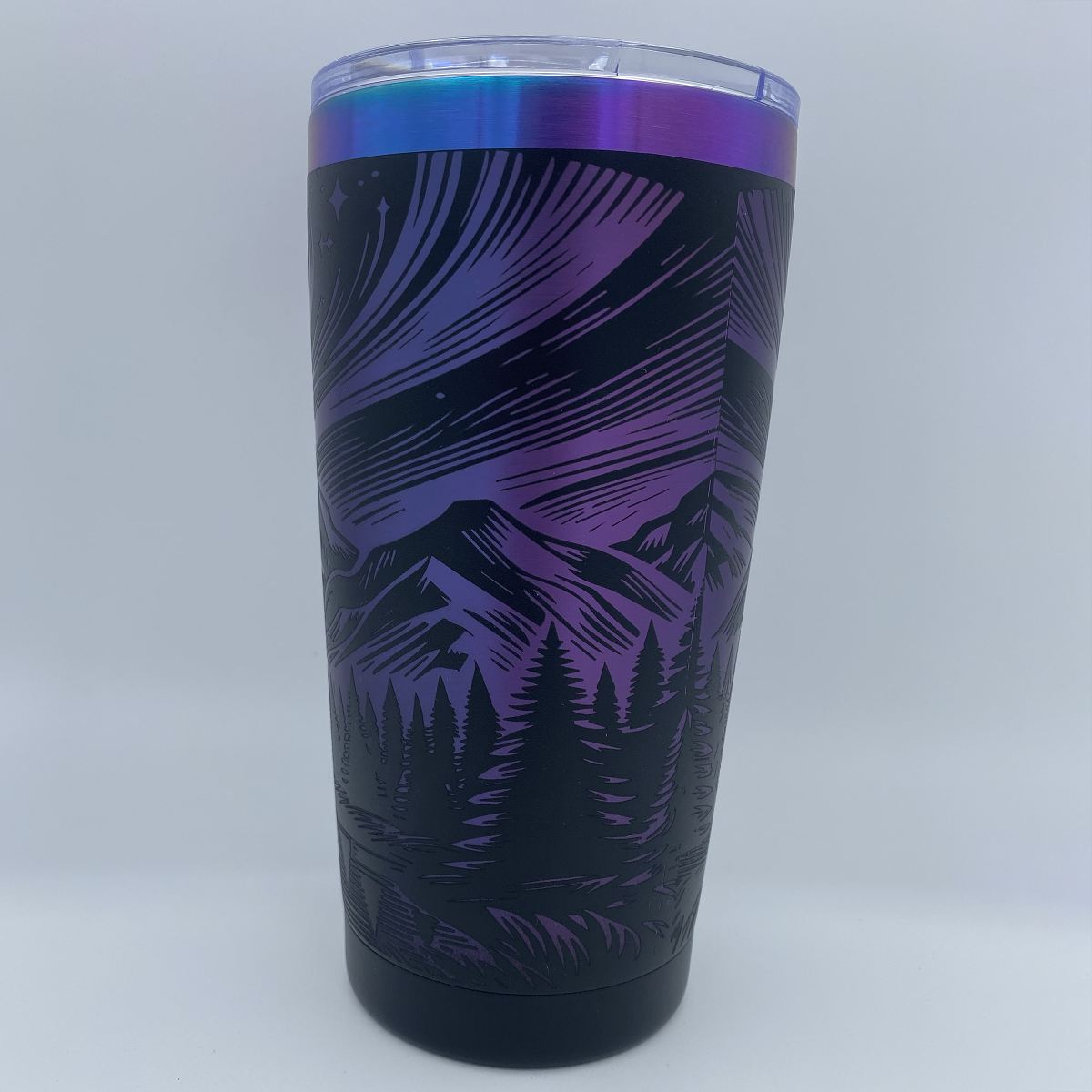 Aurora Mountain engraved tumbler in blue and purple rainbow finish with laser engraved northern lights and mountain design