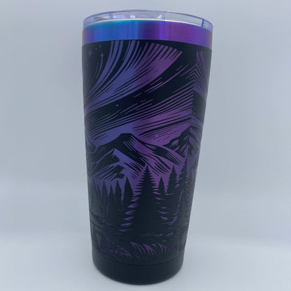 Aurora Mountain engraved tumbler in blue and purple rainbow finish with laser engraved northern lights and mountain design