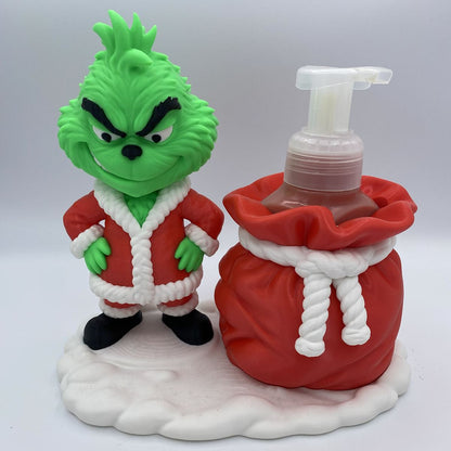 Close-up of Grinch soap holder holding a Bath and Body Works bottle