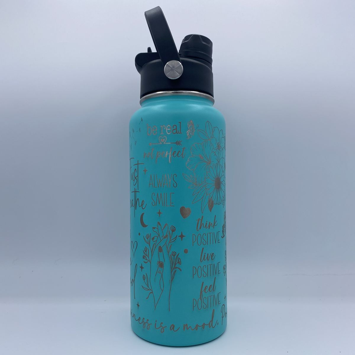 Teal 32oz Happy Thoughts laser engraved motivational water bottle with dual lid