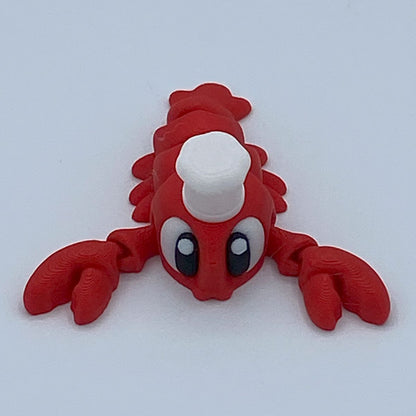 Red lobster figurine on a white background