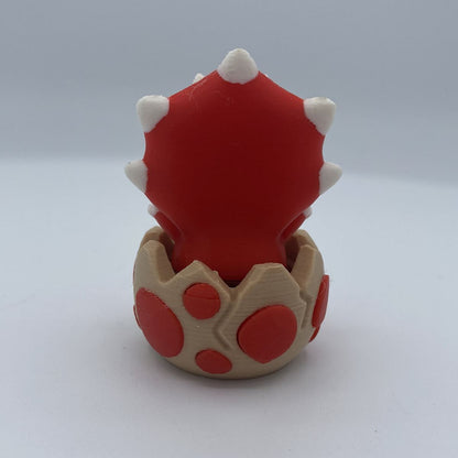 Baby dino clicker fidget shown from another angle