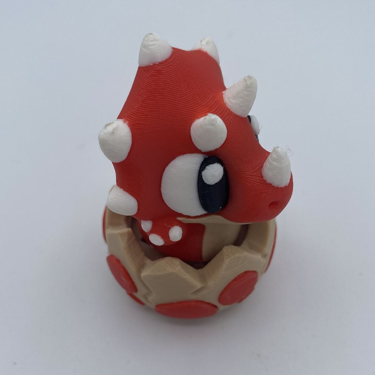 Close-up of baby dinosaur clicker fidget