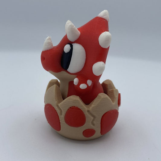 Baby dino clicker fidget shown from another angle