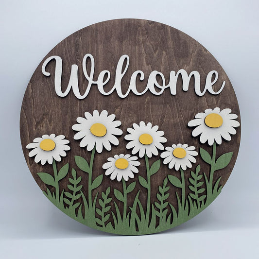 Fully layered Welcoming Daisies laser-cut wood door sign with the word Welcome
