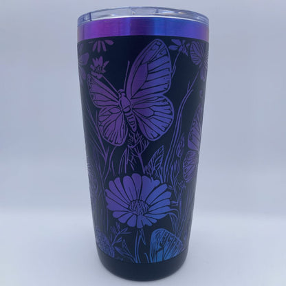 Wildflowers and Butterflies engraved tumbler in blue and purple rainbow finish with laser engraved floral design