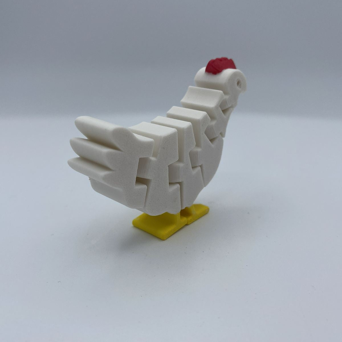 Flexi chicken posed in different positions showing articulated joints
