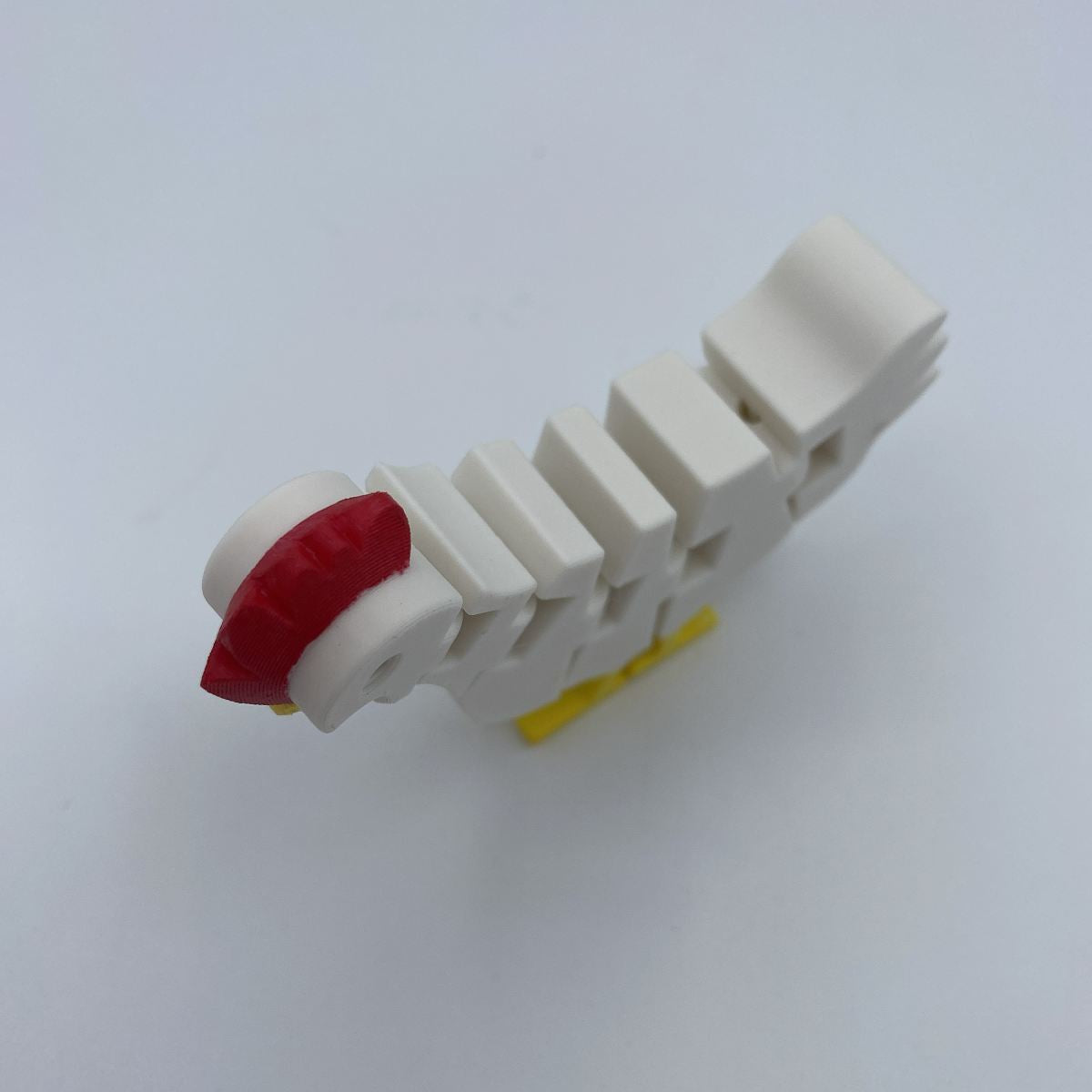Flexi chicken posed in different positions showing articulated joints